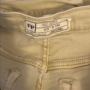 Busted knee skinny jeans